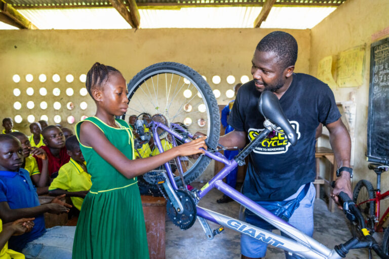 From left to right: Beneficiaries Mohamed Fofanah, Isatu Bangura and  Principal John Brima Tholley.